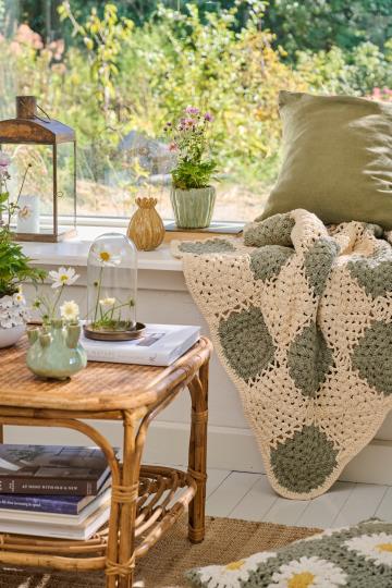 Cream crochet blanket with green squares