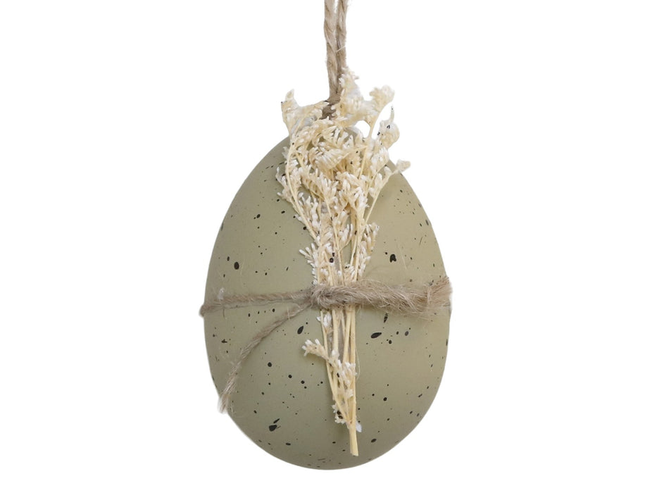 Uovo di Pasqua d'appendere verde polvere con fiore secco
