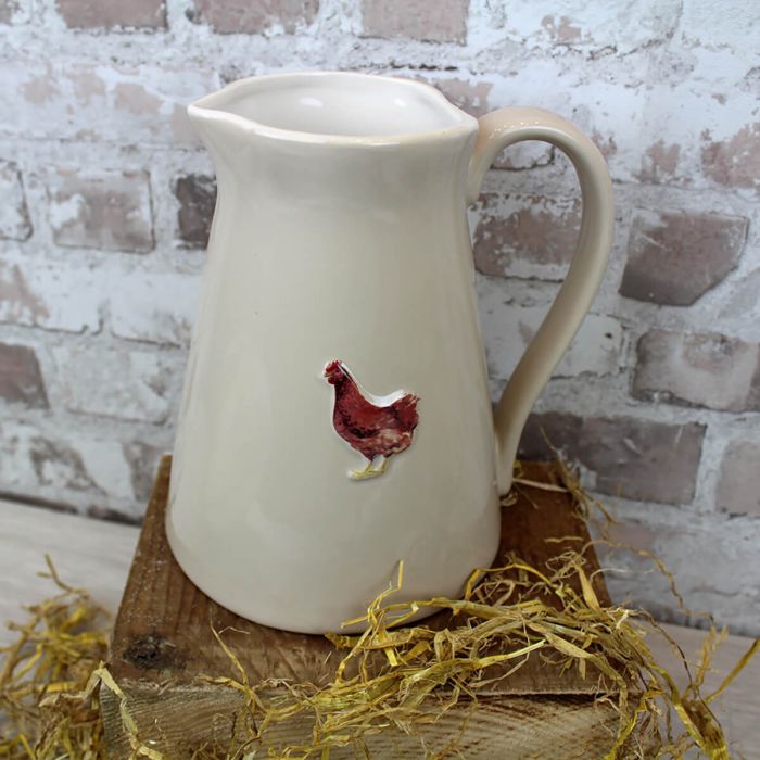 Brocca in ceramica con motivo in rilievo gallo
