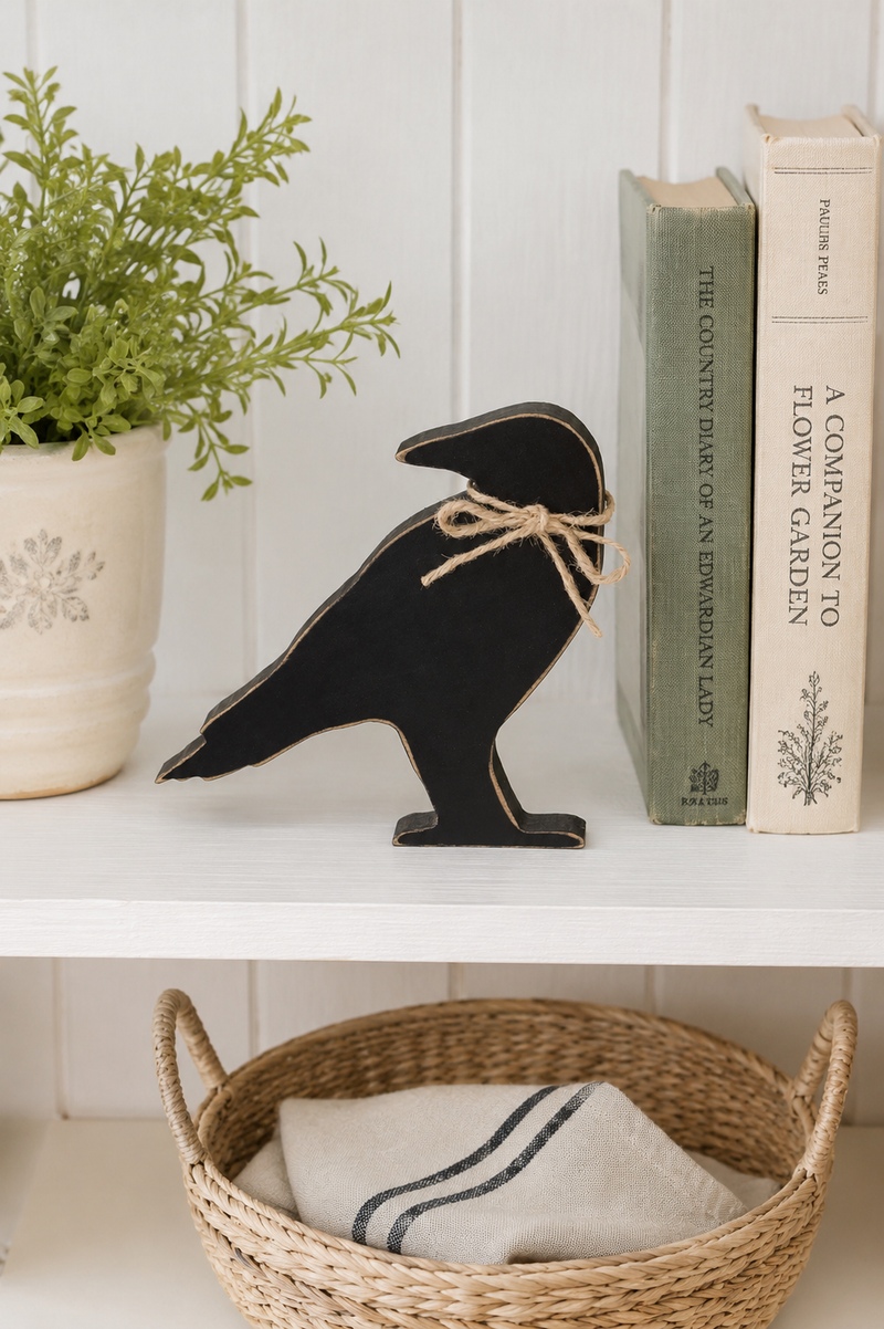 Corvo Decorativo in Legno Nero con Fiocco