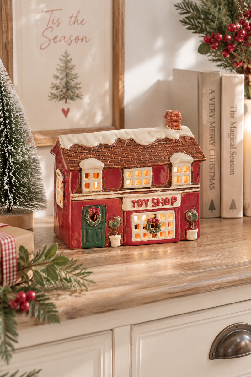 Casetta Negozio di Giocattoli Natalizia in Ceramica Porta Tealight – 15,5 cm