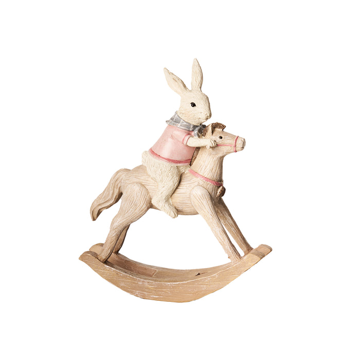 Lapin rose sur un cheval à bascule 