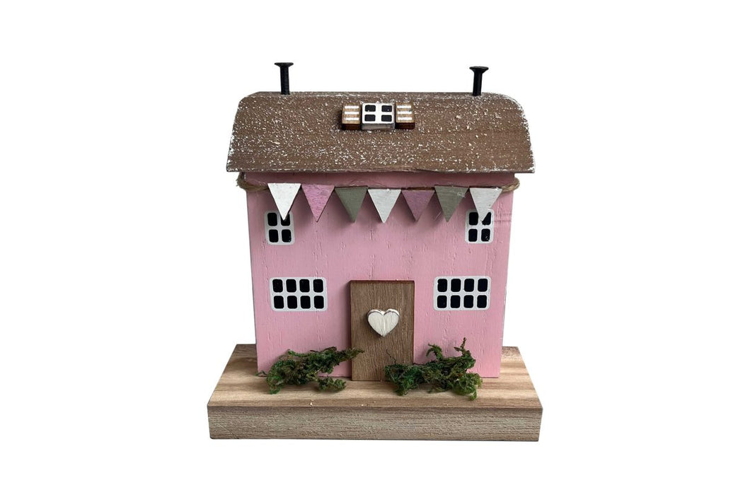 Casa decorativa in legno rosa