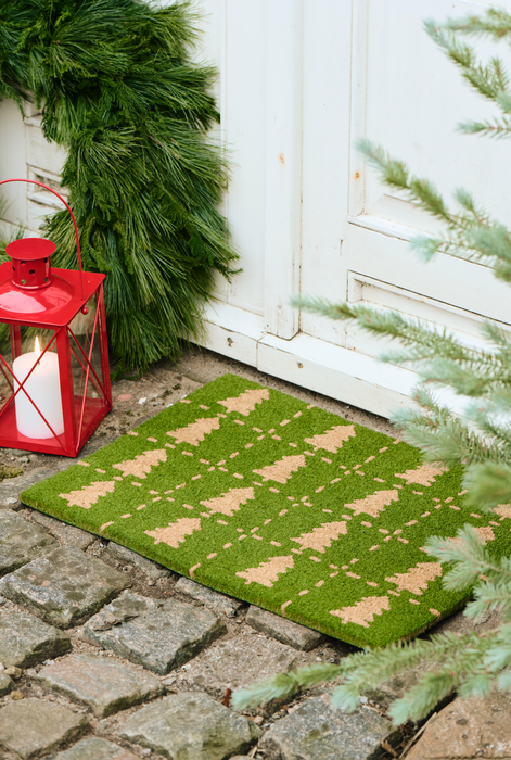 Green doormat with Christmas trees by Ib Laursen