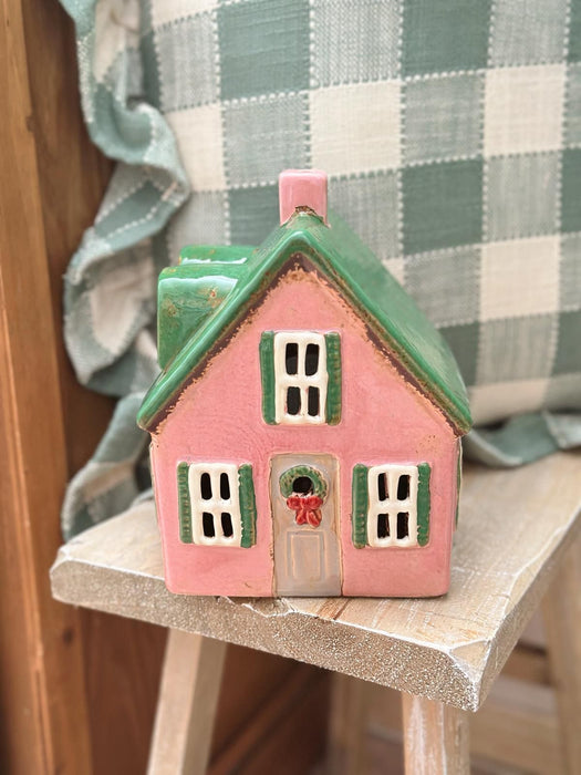 Casa luminosa verde e rosa