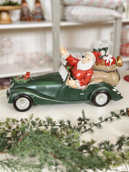 Babbo Natale in Resina con Auto Verde – 30x15x16 cm