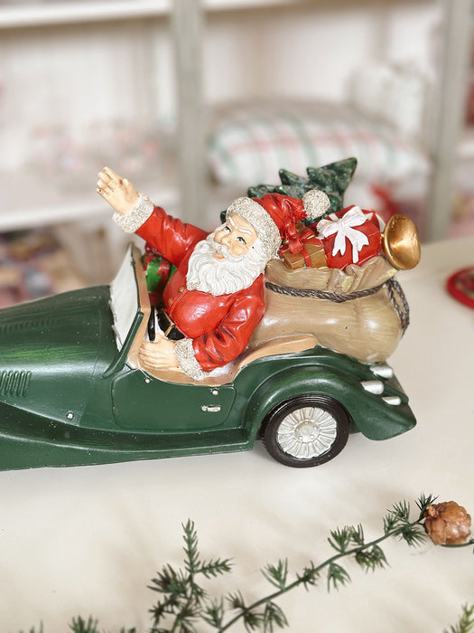 Babbo Natale in Resina con Auto Verde – 30x15x16 cm