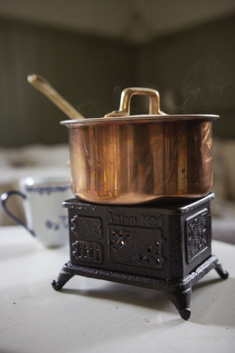 Scaldavivande Mini Stufa in Ghisa Nera a Forma di Cucina a Legna