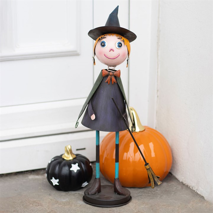 Metal witch with broom